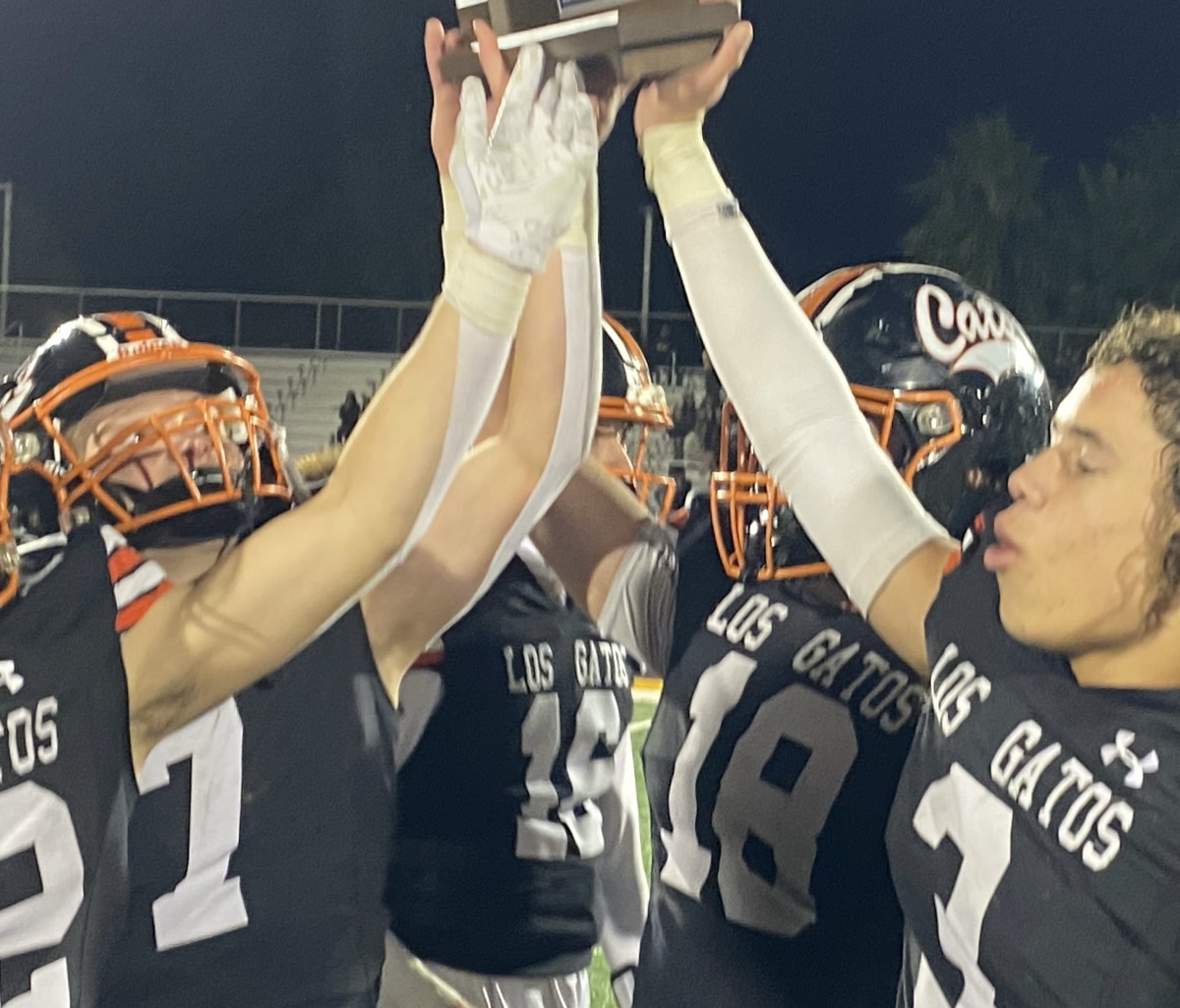 Jaylen Thomas (3), Spencer Burg (18), AJ Minyard (16) and Scott Garwood (7) among those holding up the CCS championship trophy. 